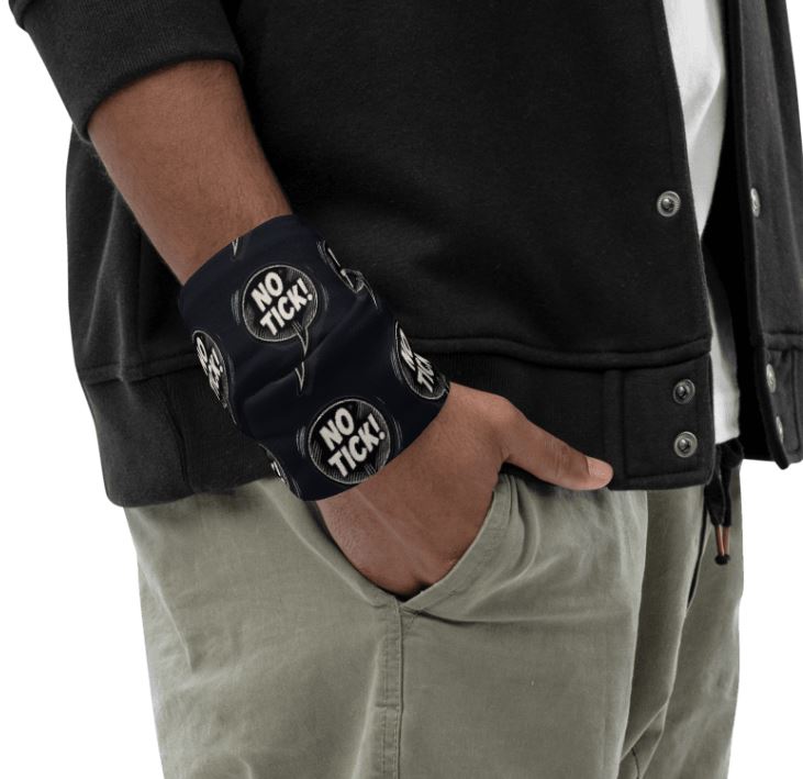 Person wearing a black face mask with 'NO TICK!' white text on a black background